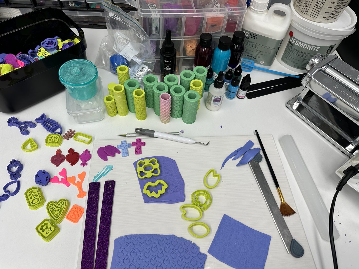 The RollerCAD studio desk, covered in polymer clay and tools